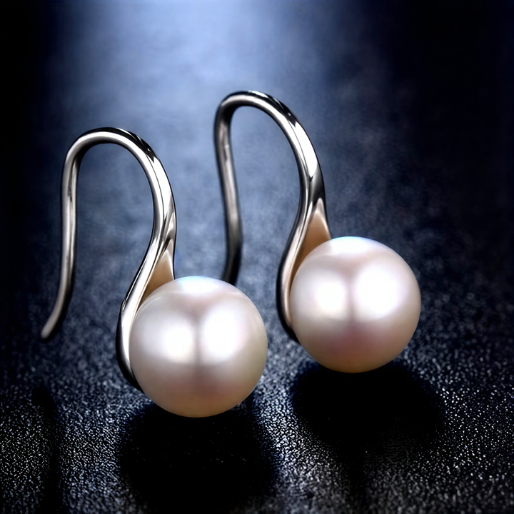 Les Boucles d'Oreilles Perle Signature